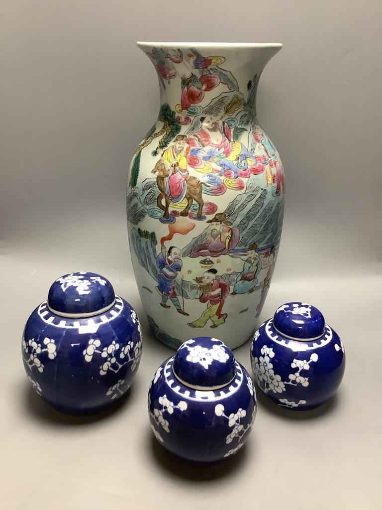 A Chinese enamelled porcelain baluster vase and three Chinese prunus blossom ginger jars, tallest 39cm